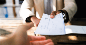 Handing over a Personal Injury settlement check